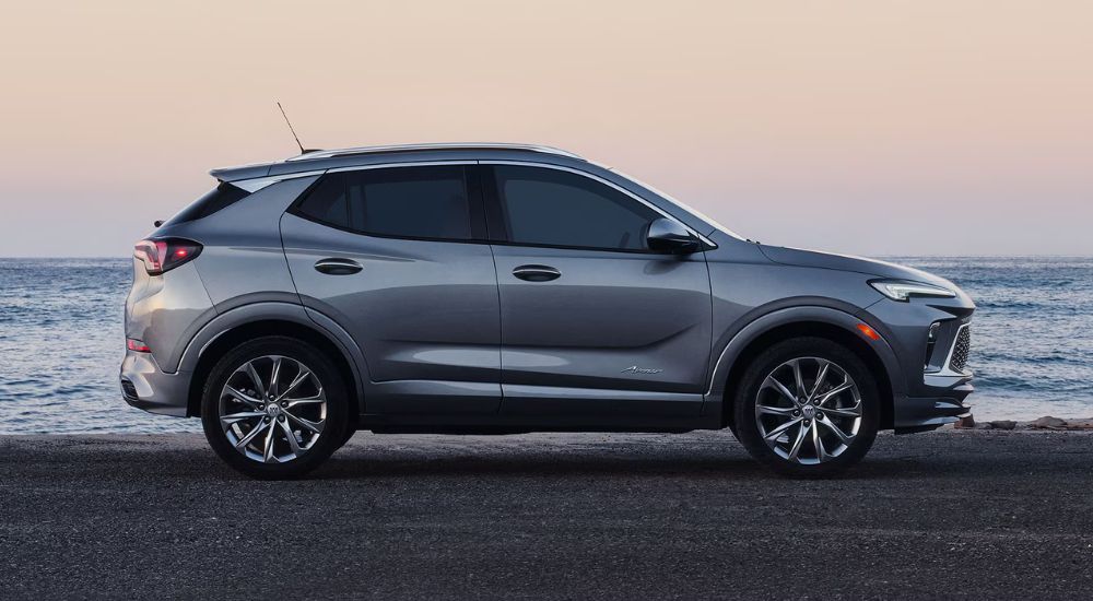 Grey 2026 Buick Encore GX parked in front of the ocean.