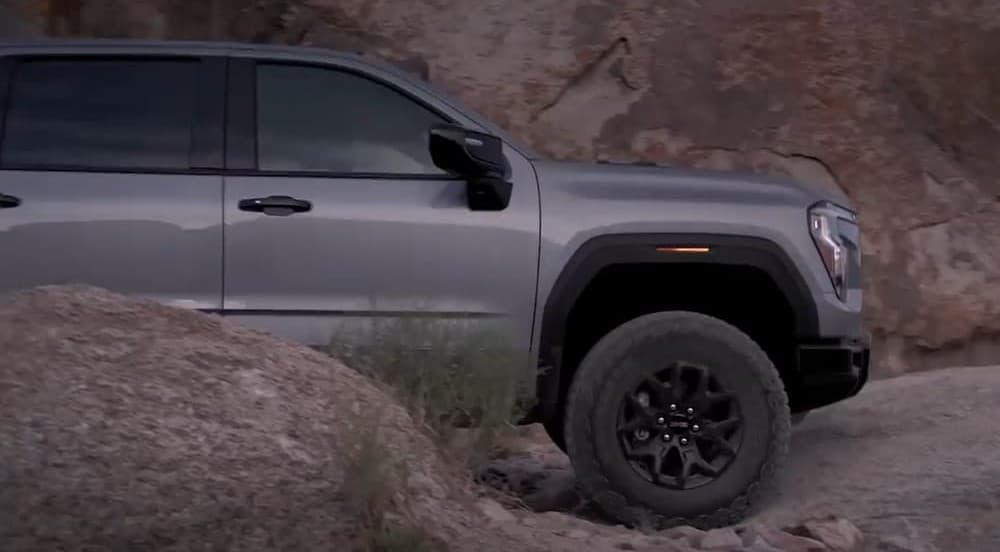 A gray 2027 GMC Sierra 1500 parked offroad.