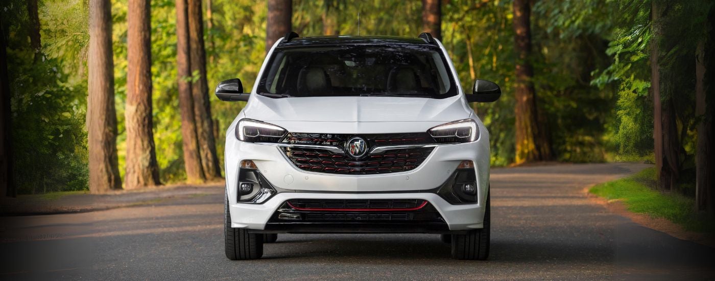 White 2020 Buick Encore GX driving down a road.