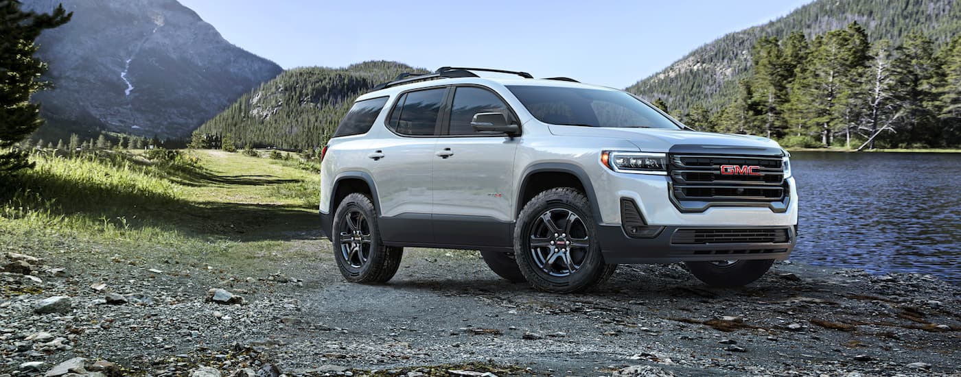 White 2023 GMC Acadia AT4 parked at an angle