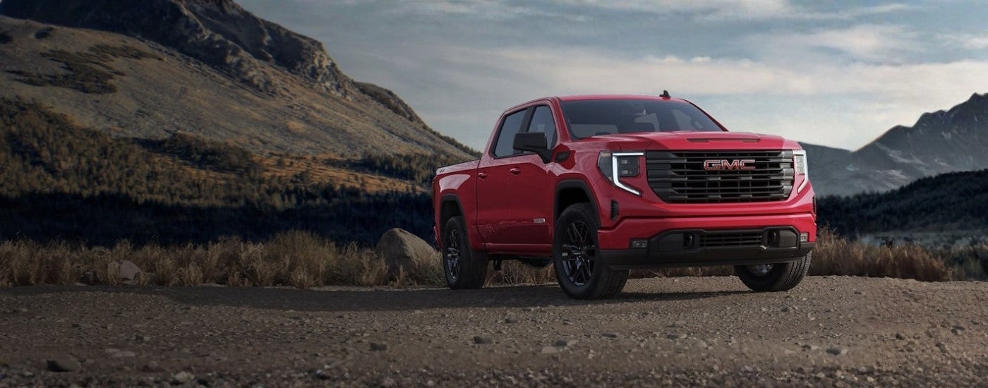 Red 2023 GMC Sierra 1500 Elevation parked off-road