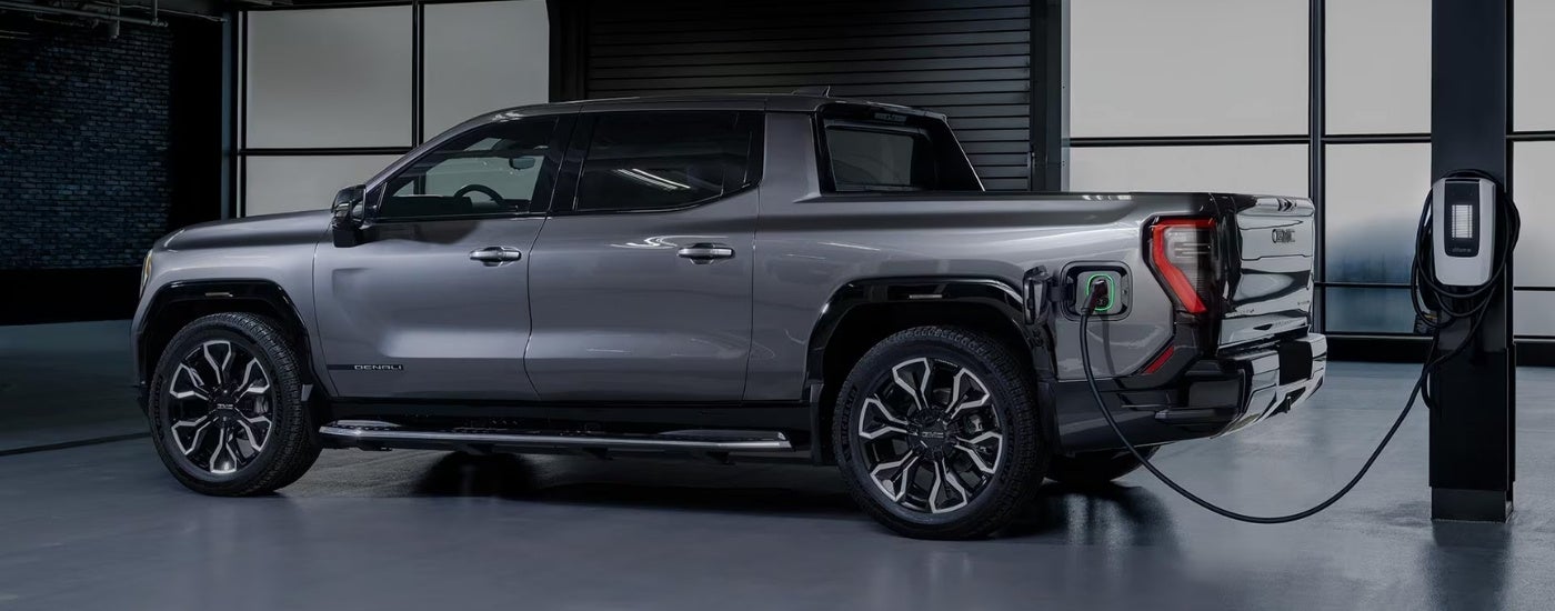 Grey 2024 GMC Sierra EV parked in a garage