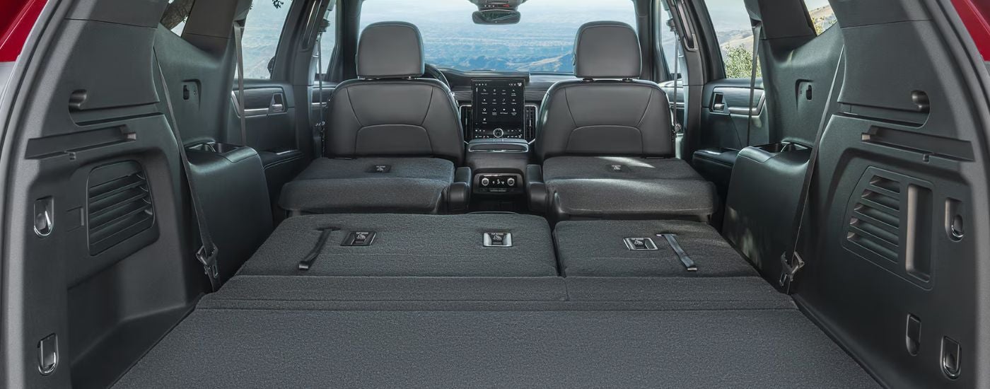 The interior of a 2026 GMC Acadia from the cargo area.