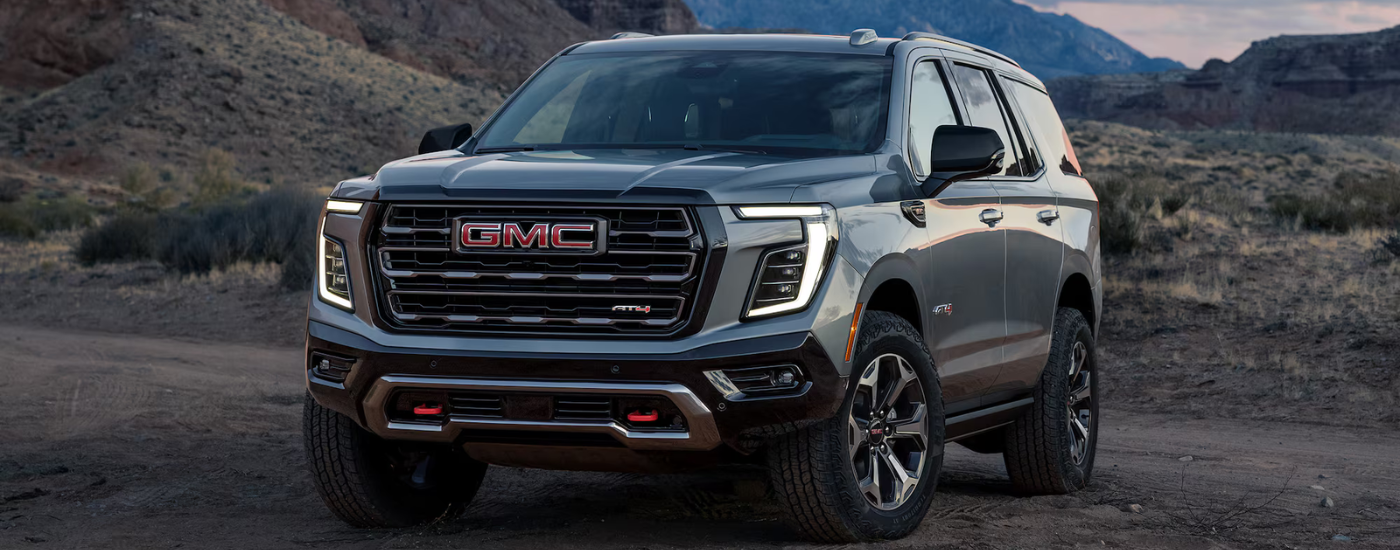 Grey 2026 GMC Yukon AT4 parked off-road