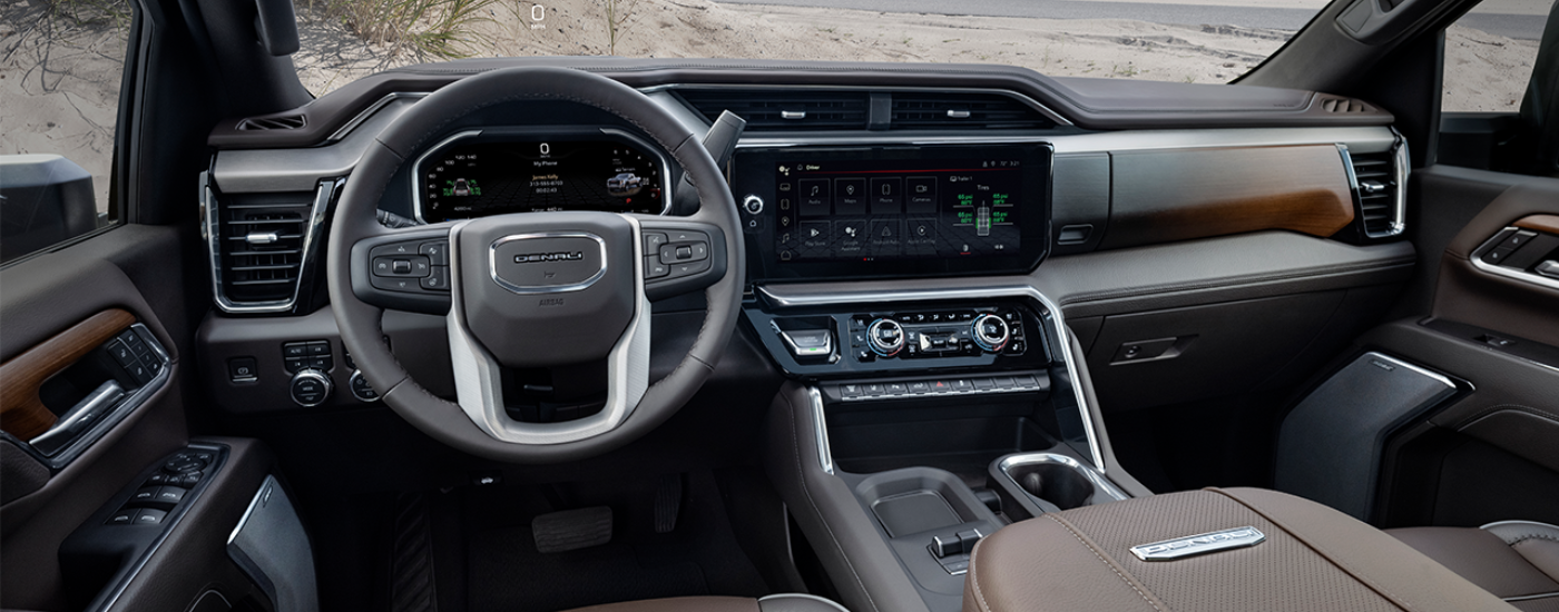 Brown and black leather interior of a 2027 GMC Sierra 2500 Denali Ultimate