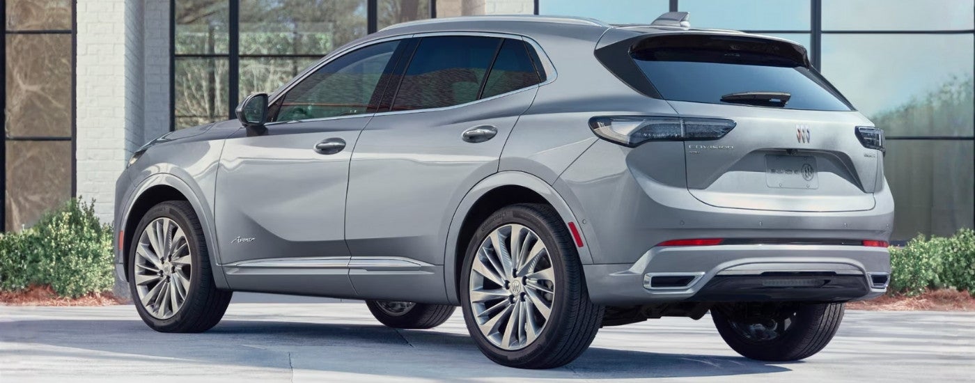 Silver 2024 Buick Envision Avenir parked in front of a building