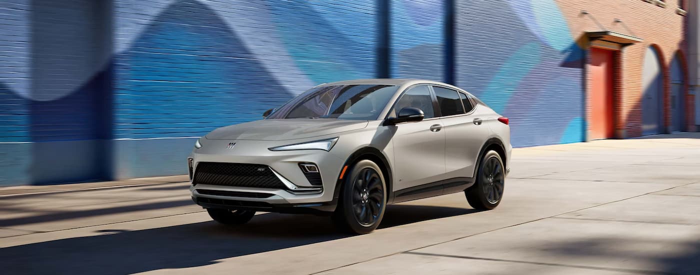 Silver 2026 Buick Envista parked near a colorful wall