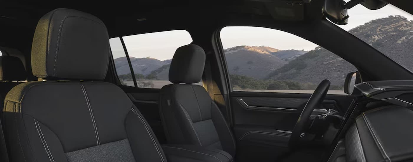 The black interior seating in a 2026 GMC Acadia.