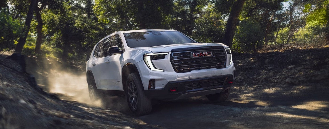A white 2026 GMC Acadia for sale from the front at an angle.