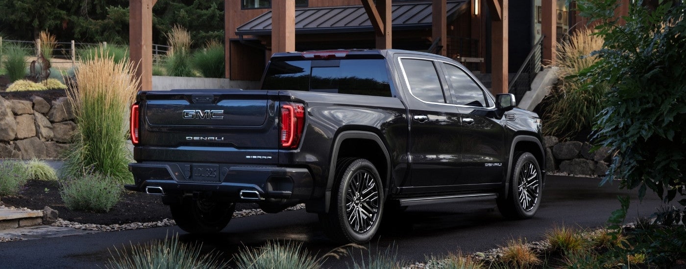 A black 2025 GMC Sierra 1500 from the rear at an angle.
