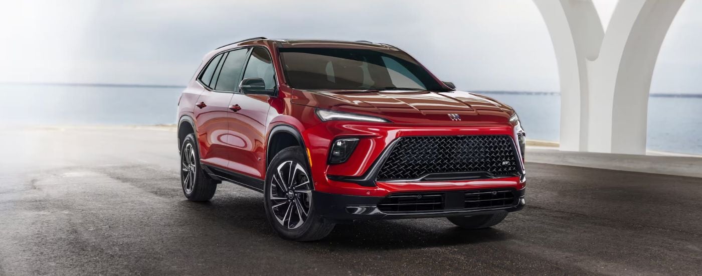 A red 2025 Buick Enclave ST parked from a dealer near Dothan