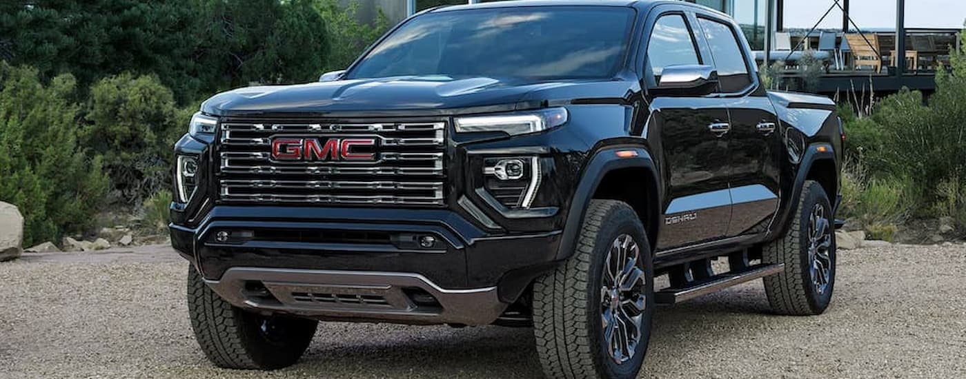 A black 2026 GMC Canyon parked off-road